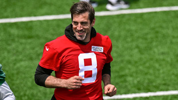 Jets quarterback Aaron Rodgers (8) warms up during OTA s at Atlantic Health Jets Training Center.
